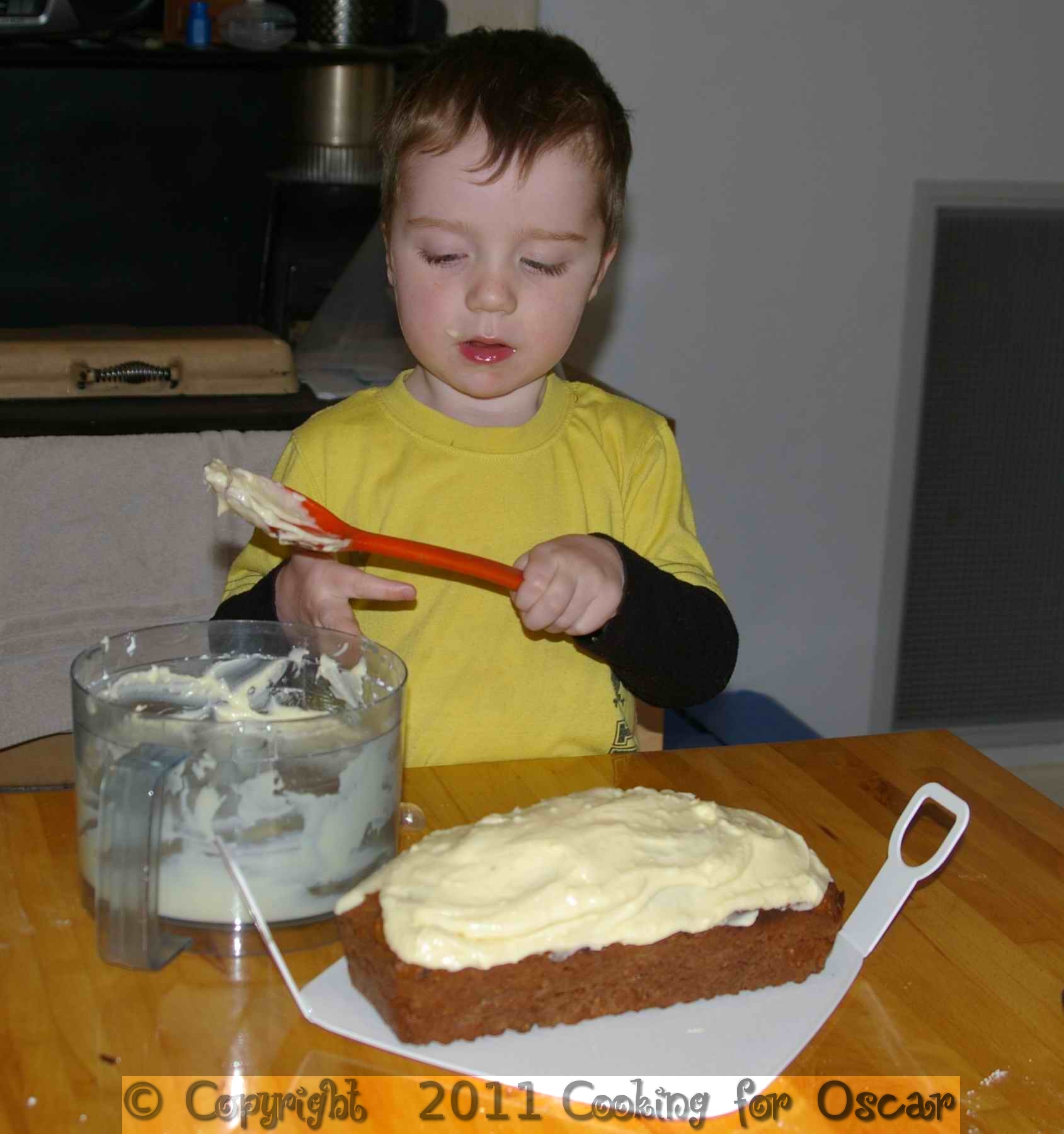 Oscar Icing a Carrot Zucchini and Apple Loaf